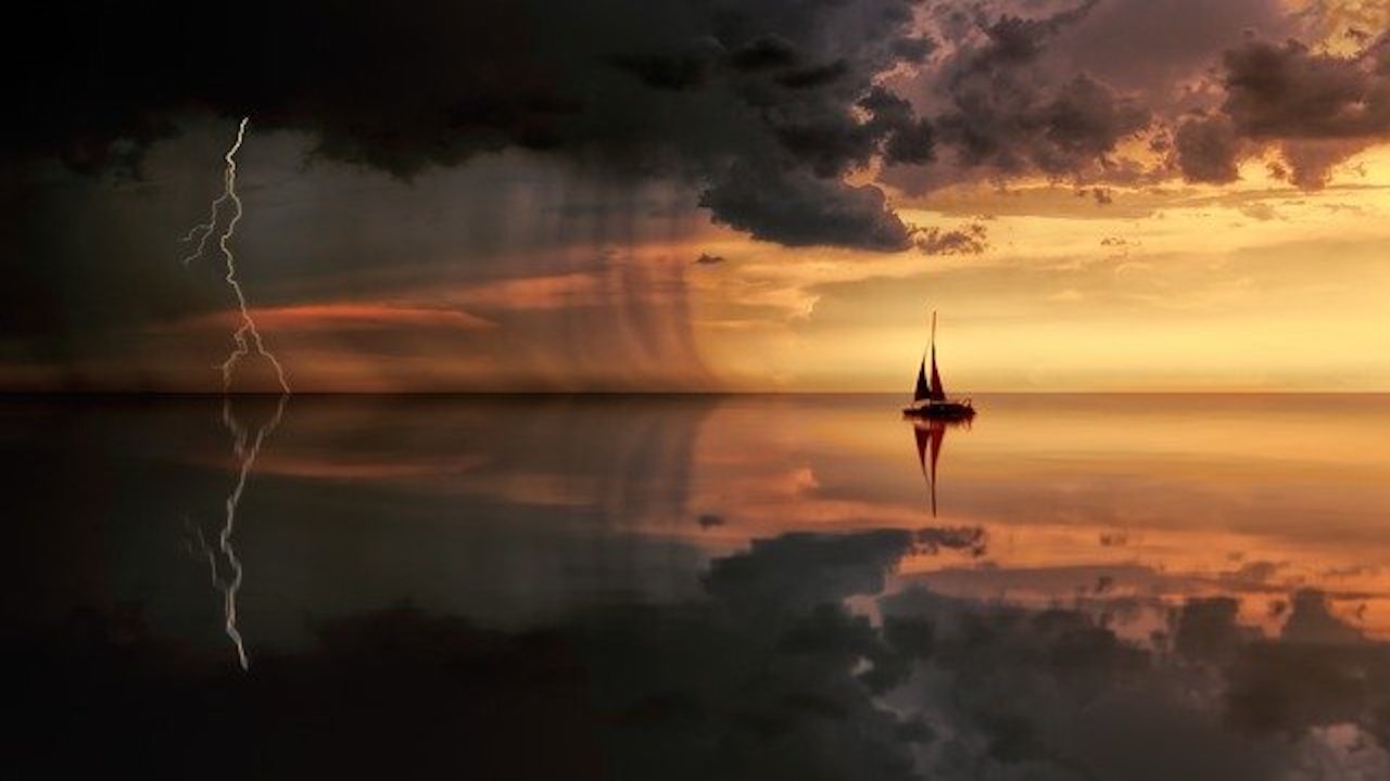 Boat on Lake During a sunset with sark clousds. 1. Causes of Emotional Overwhelm, Mental Health, Physical Health1. Causes of Emotional Overwhelm, Mental Health, Physical Health